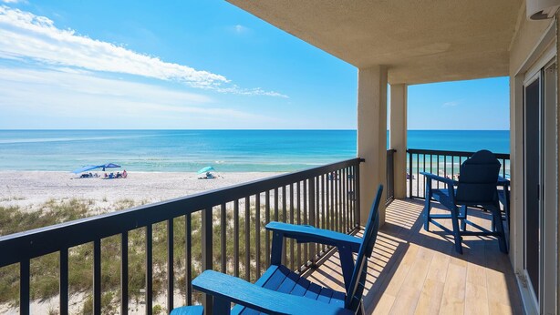 A balcony with a view of the beach and ocean. - 🌴 Oceanfront Pinnacle Port Escape | Sleeps 8 | Last Week of July Available! (Panama City Beach)