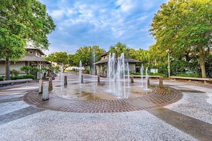 Stroll through this serene public square surrounded by lush greenery and tranquil water features.