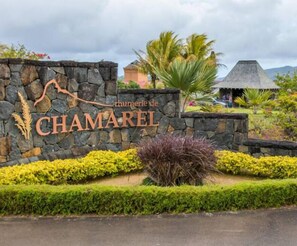 Welcome to Chamerel, where a serene garden and rustic charm await.