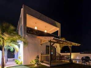 Enjoy outdoor dining or relaxation on the covered patio, or take in the view from the elevated balcony.