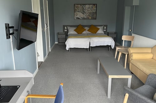 Desk, laptop workspace, free WiFi, bed sheets
