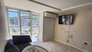 Comfort Condo, 1 King Bed with Sofa bed | Living area | Flat-screen TV - Island GetAway Condo Portmore Jamaica (Portmore)