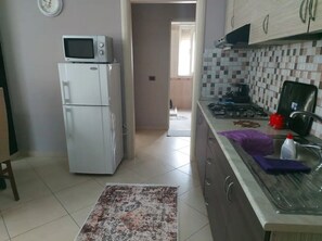 Panoramic Apartment | Private kitchen | Fridge, microwave, oven, toaster