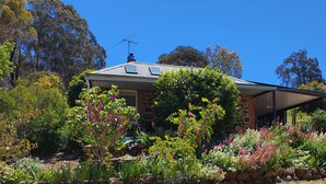 A house with a sloped roof, a chimney, and a satellite dish. - Beautifully renovated country cottage located near Mclaren Vale's best wineries (Clarendon)