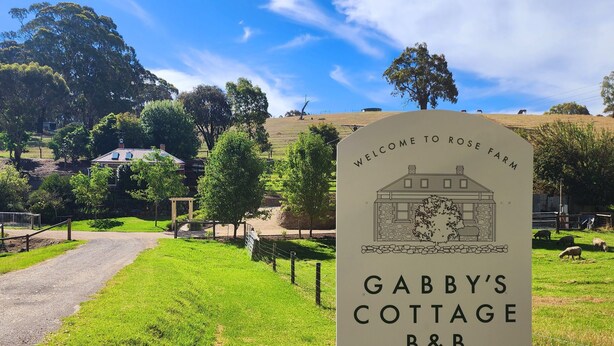 A sign welcoming visitors to Rose Farm, indicating the location of Gabby's Cottage B&B, established circa 1850. - Beautifully renovated country cottage located near Mclaren Vale's best wineries (Clarendon)