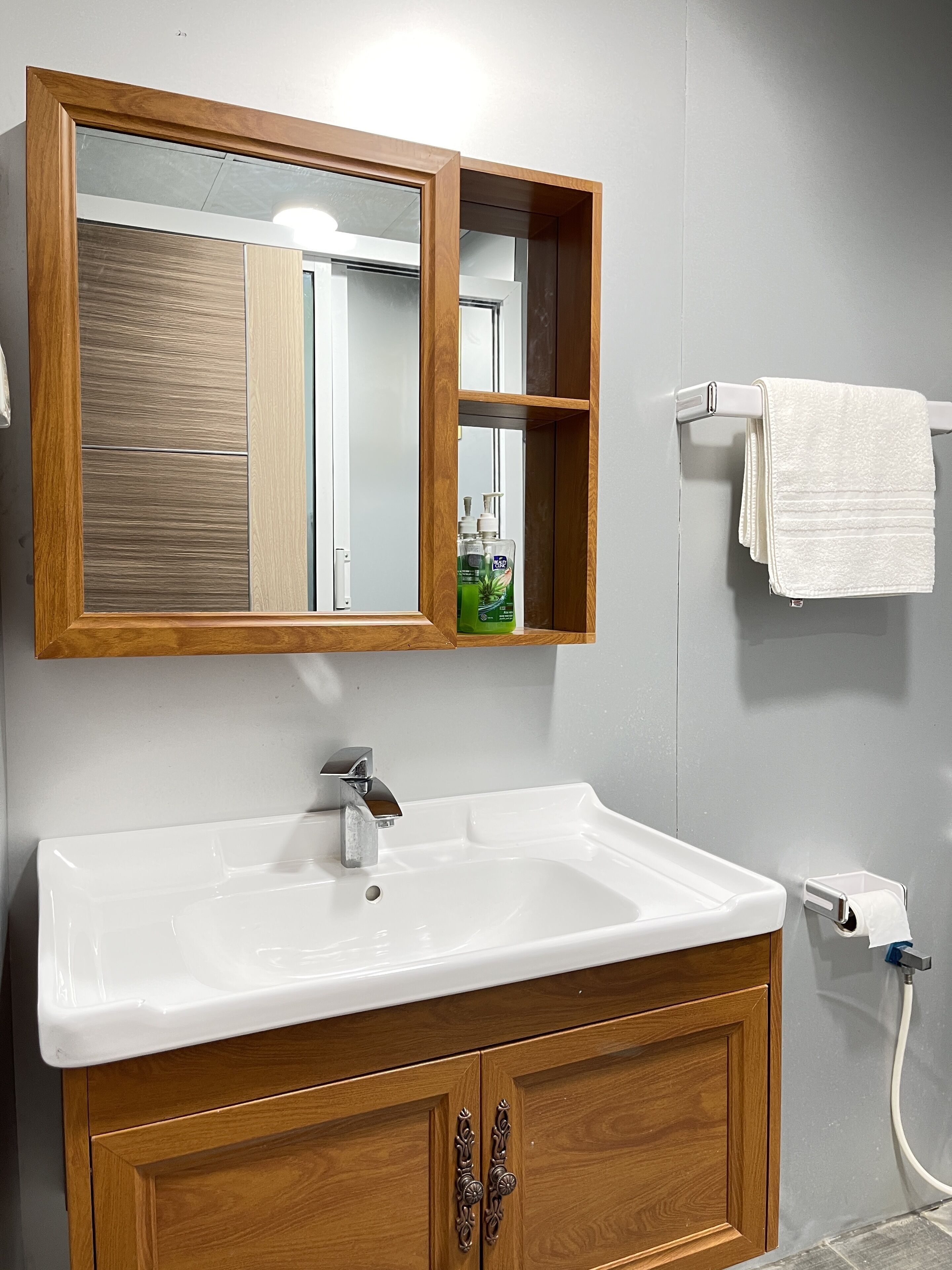 Shower, rainfall showerhead, hair dryer, towels