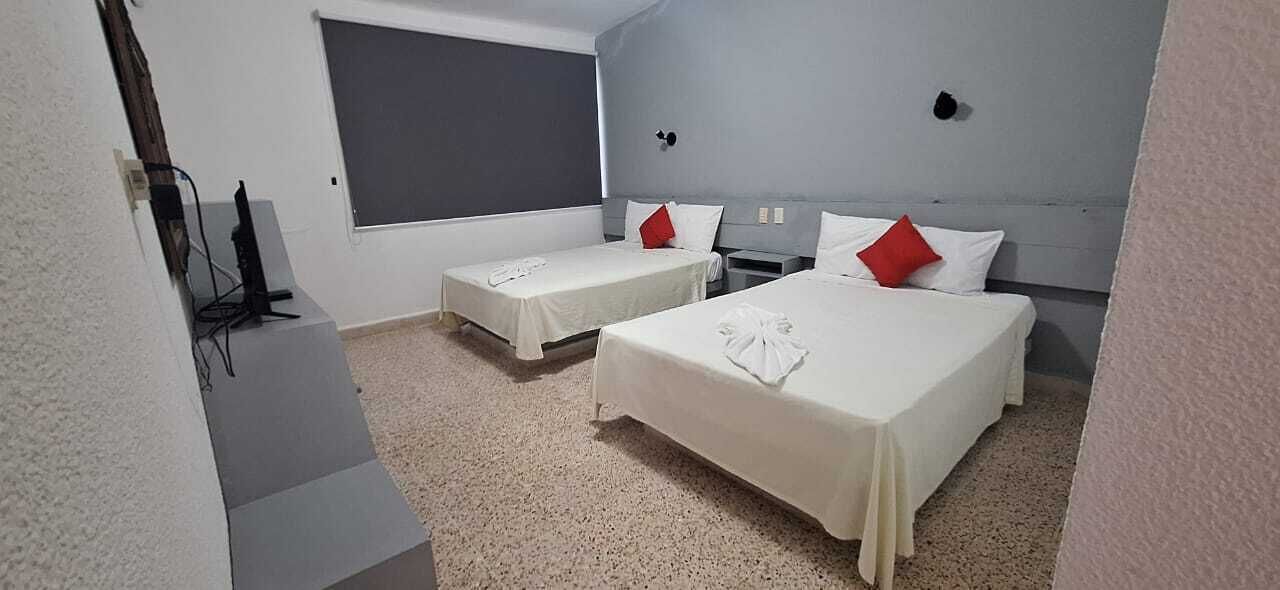 Standard Quadruple Room, 2 Double Beds | Free WiFi, bed sheets