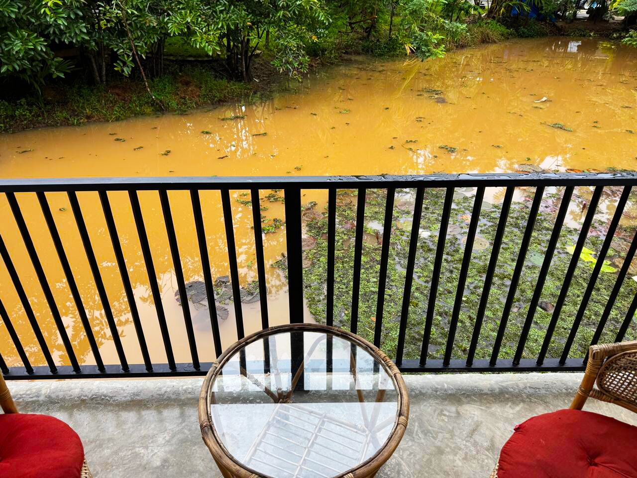 A balcony with a view of a river.
