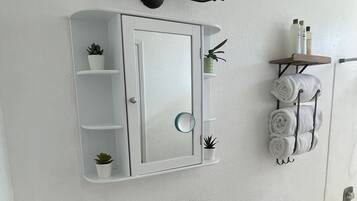 Hair dryer, towels, soap, shampoo