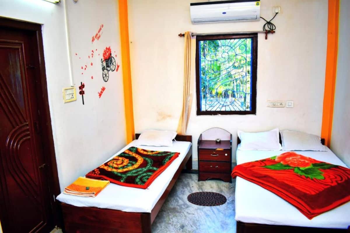 Laptop workspace, bed sheets