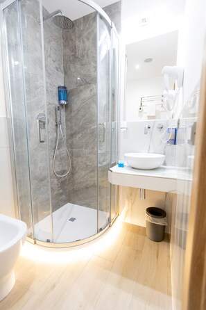 Standard Single Room, City View | Bathroom | Shower, free toiletries, hair dryer, slippers