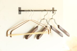 A metal rack with multiple hangers against a wall. - Seaside Harbor Odawara (Odawara)