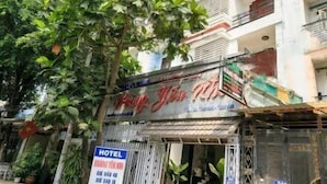 A hotel with a signboard indicating it is a hotel.