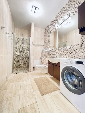 Shower, hair dryer, towels, soap