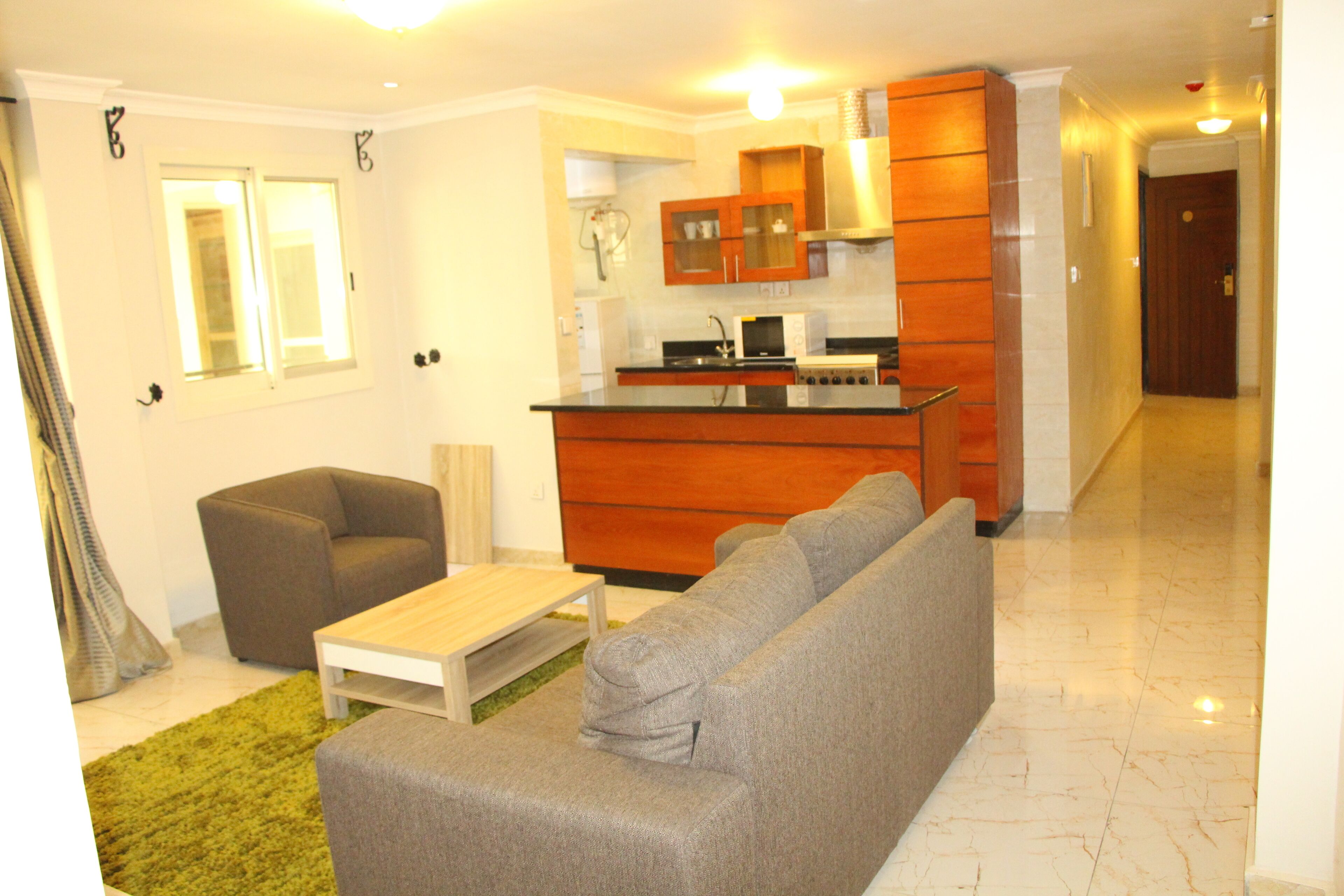 Apartamento Deluxe | Zona de estar | Una televisión de pantalla plana