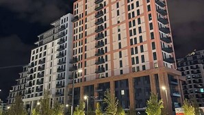A multi-story residential building with a modern architectural design, featuring balconies and a uniform facade. - Belgrade Waterfront Tower View (Belgrade)