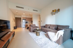 Apartamento luxo | Área de estar | Smart TV 55 polegadas com canais a cabo