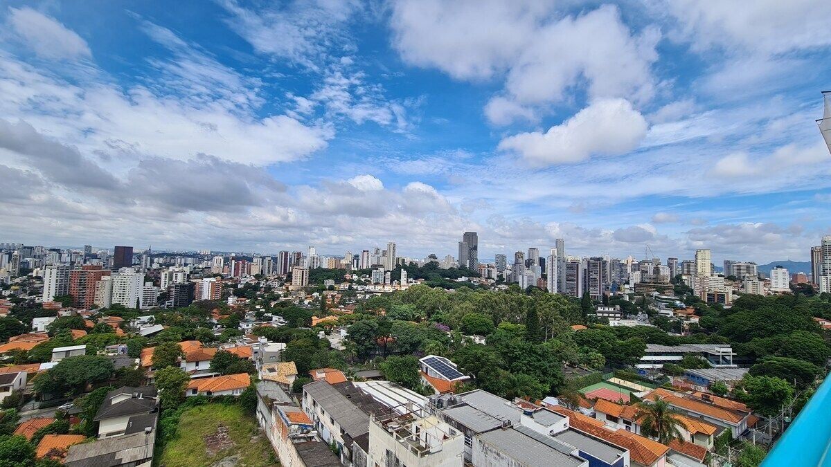 A cityscape with high-rise buildings, residential areas, and greenery.