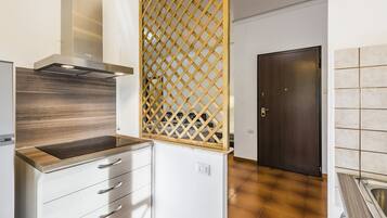 Fridge, electric kettle, cookware/dishes/utensils, dining tables