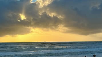 On the beach, sun-loungers, beach towels
