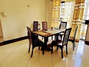 Family Apartment | Living area | 24-inch Smart TV with digital channels - Lux Suites Marrakech Apartments (Mombasa)