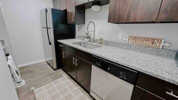 Fridge, coffee/tea maker, cookware/dishes/utensils