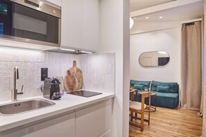 Fridge, microwave, stovetop, coffee/tea maker
