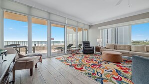 A spacious balcony with a view of the beach, furnished with a sofa, chairs, and a dining table. - 3rd Floor!! Parking Level!  Avoid the Elevators!! Lazy River!! (Orange Beach)