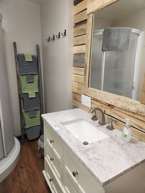 Shower, hair dryer, towels, soap