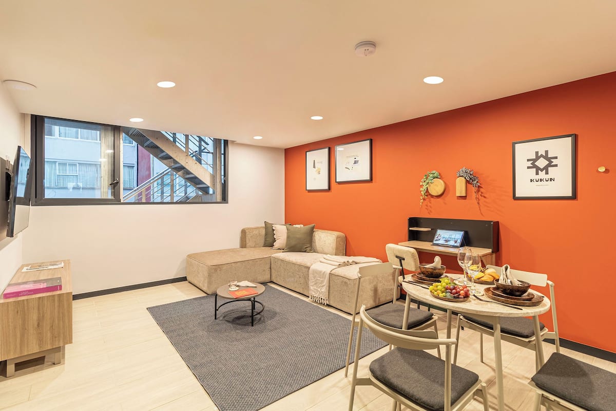 Superior Apartment, 1 Bedroom | Living area | 50-inch Smart TV with satellite channels