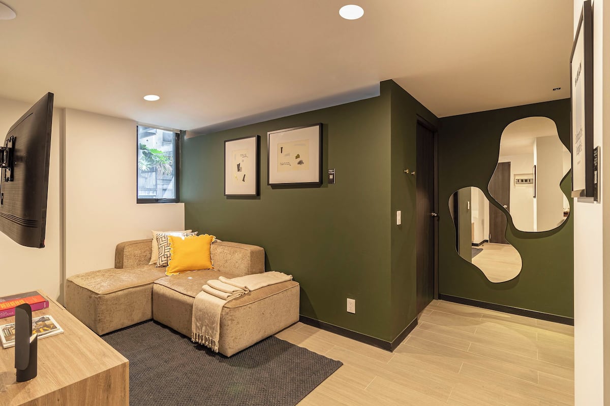City Apartment | Living area | 50-inch Smart TV with satellite channels