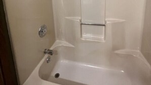 A bathroom with a bathtub, a shower, and a toilet. - White Lake Lodge - Family Room - Room 6 - Sleeps 5 (White Lake)