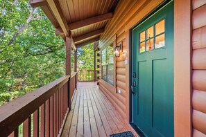 Property grounds - Escape to CMC Stays cabin in Pigeon Forge, offering over 2,500 square feet of luxurious living space. This cabin is 0.8 miles from the Pigeon Forge strip. It is a 4-bedroom, 3-bathroom home with a theater, game room, and hot tub. It sleeps 12. (Pigeon Forge)
