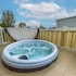 Caravansleeps8-hottub-fireplace-garden-patio