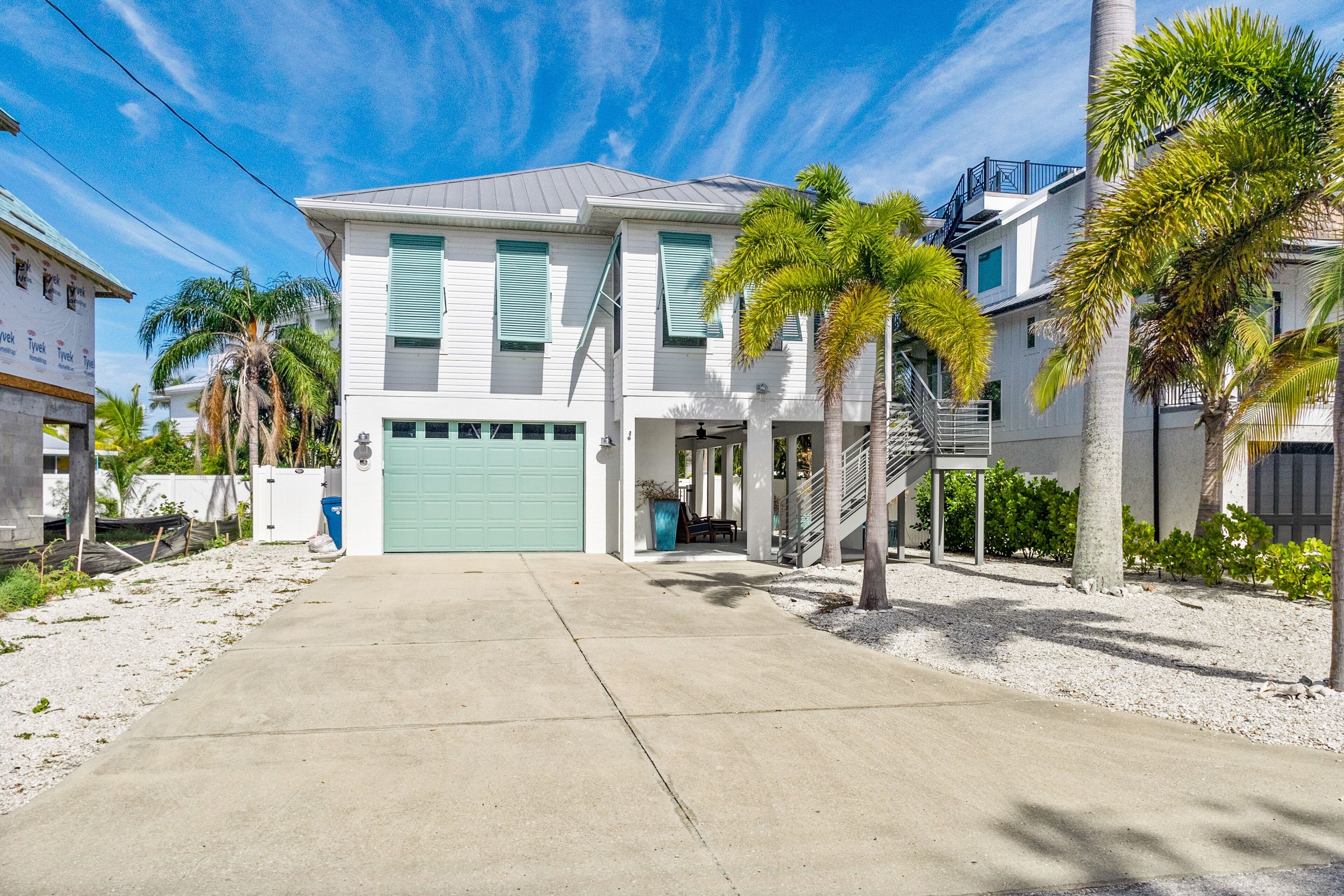 Updated home near the beach with saltwater pool, balcony, AC, & soaking tub
