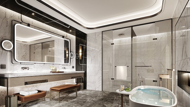 Une salle de bain moderne avec un grand miroir, une baignoire et un banc.