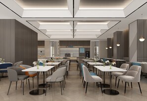 A modern dining area with multiple tables and chairs, a central counter, and pendant lighting. - Holiday Inn Express Turpan by IHG (Turpan)