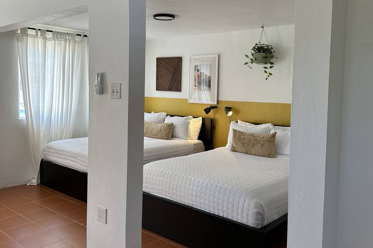 Premium bedding, memory foam beds, laptop workspace, WiFi (free)