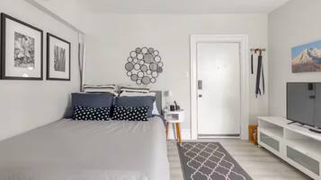 1 bedroom, desk, iron/ironing board, travel crib