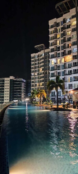 Outdoor pool, open 6:00 AM to 10:00 PM, free pool cabanas - condominium rentals at Mactan Newtown (Lapu-Lapu)