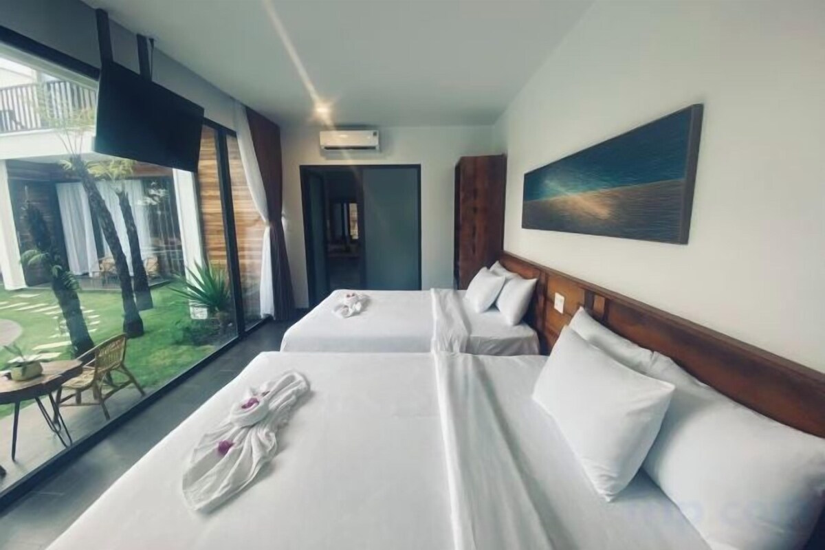 Bed In Deluxe Family Pool View