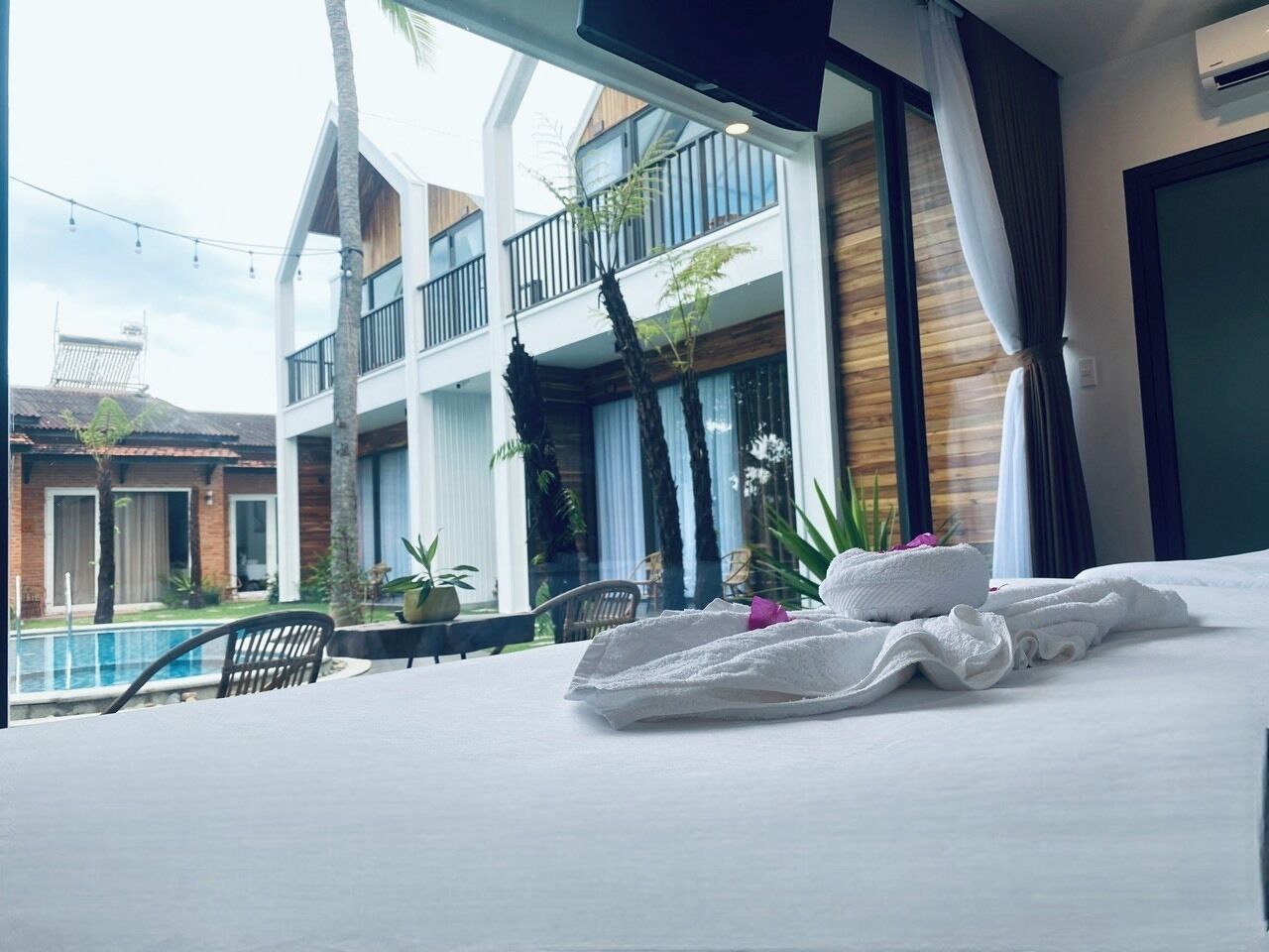 Family Quadruple Room, 2 Queen Beds, Pool View | Premium bedding, down comforters, memory foam beds, minibar