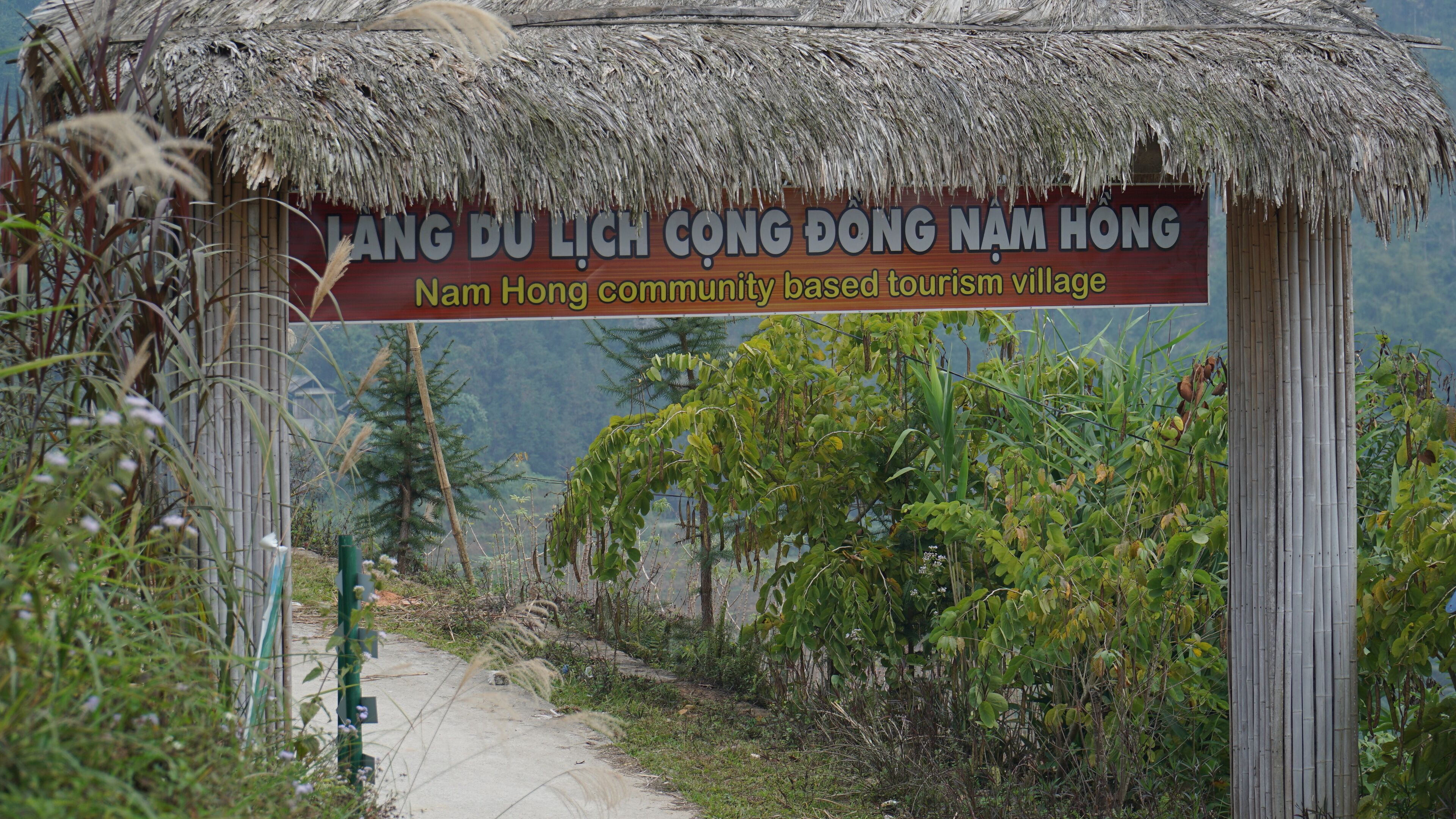 A sign for Nam Hong community-based tourism village.