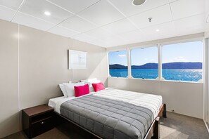 1 bedroom, desk, laptop workspace, bed sheets