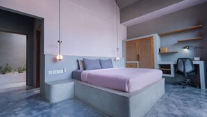 A modern bedroom with a bed, bedside tables, a desk, and a chair. - Liminal Palace Villa 1 by Betterplace (Canggu)