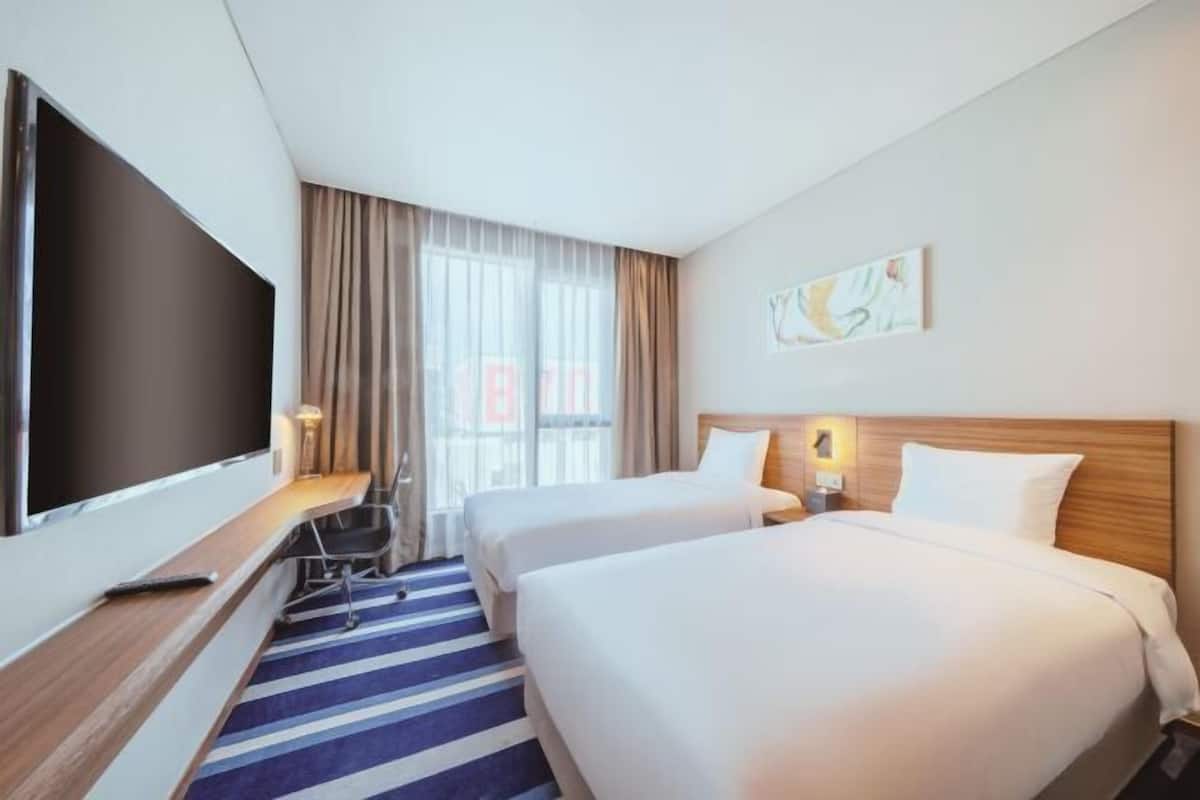 Premium bedding, desk, laptop workspace, free WiFi