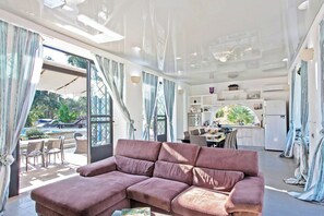 Family Villa, Multiple Bedrooms (Tenuta Bouganville With Garden And) | Living area | 21-inch flat-screen TV with digital channels - Tenuta Bouganville With Garden And Pool (Carpignano Salentino)