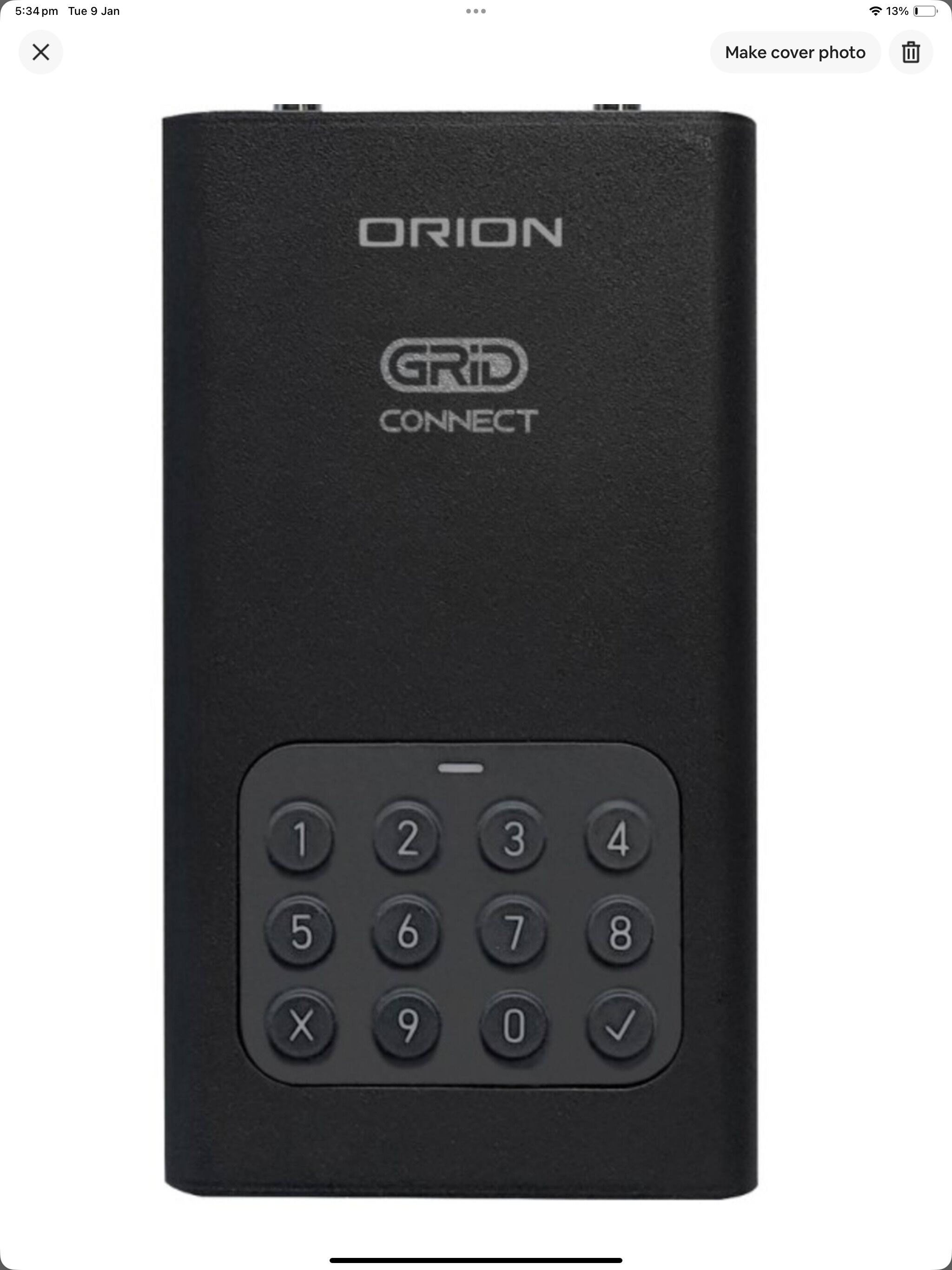 A black ORION GRID CONNECT device with a numeric keypad.
