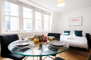 City Apartment | Living area | 40-inch Smart TV with satellite channels