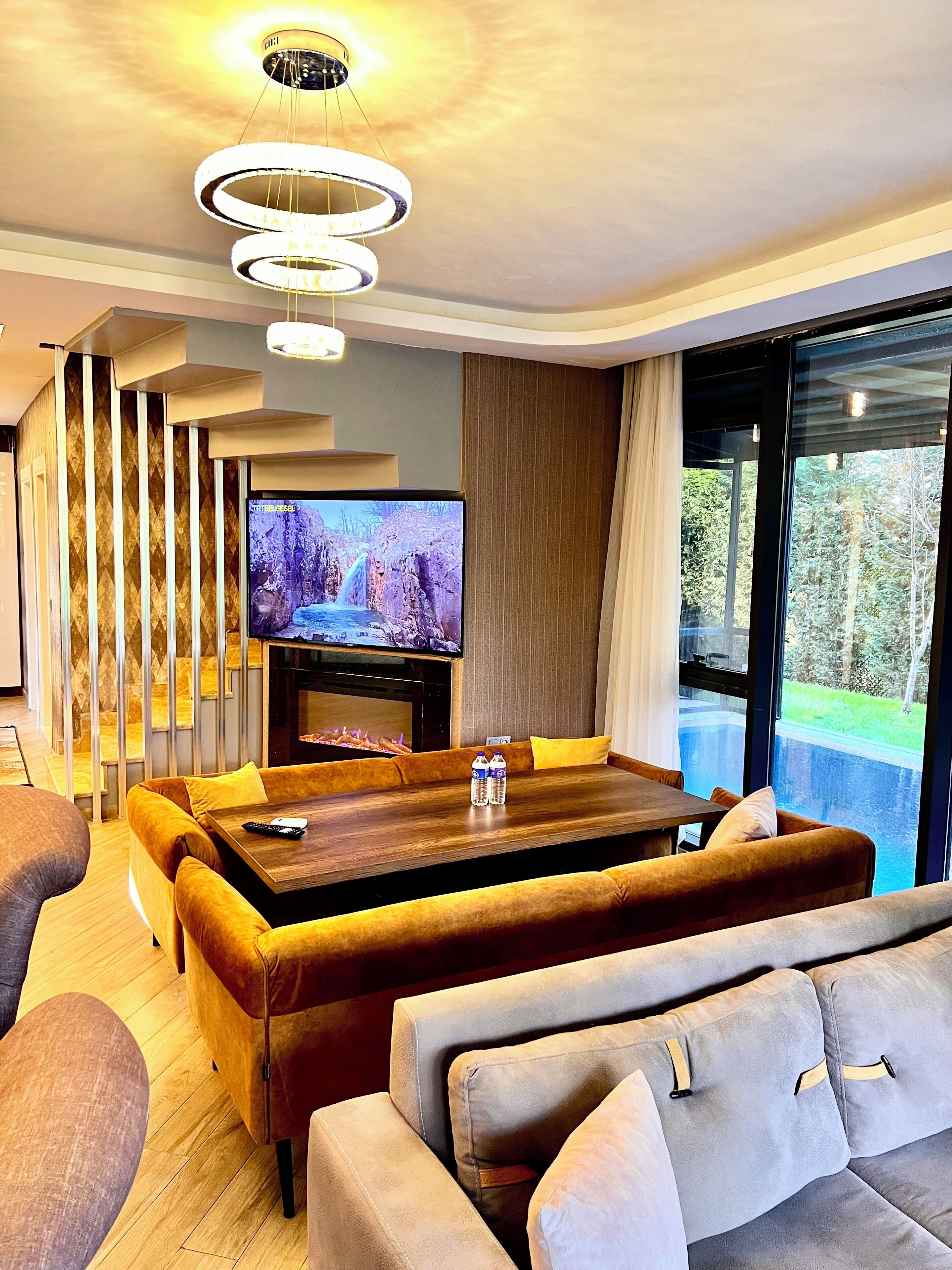 Exclusive Villa | Living area | 140-cm Smart TV with satellite channels, fireplace